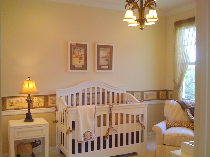Medium sized traditional gender neutral nursery in Miami with yellow walls and carpet.