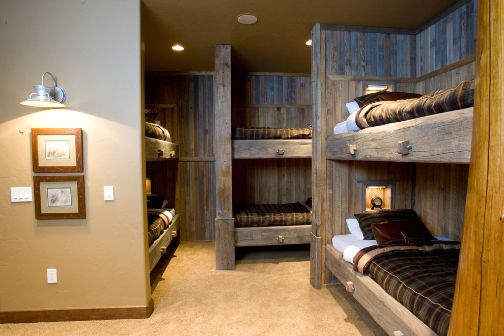 Kids' room - rustic gender-neutral carpeted kids' room idea in Denver with beige walls