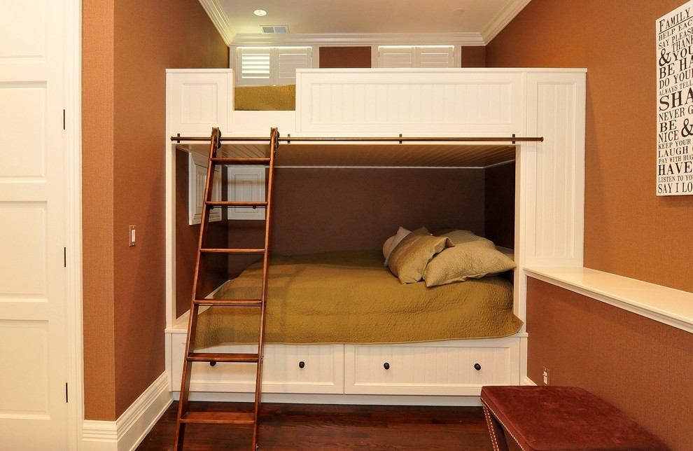 Example of a classic gender-neutral dark wood floor kids' bedroom design in Chicago with brown walls