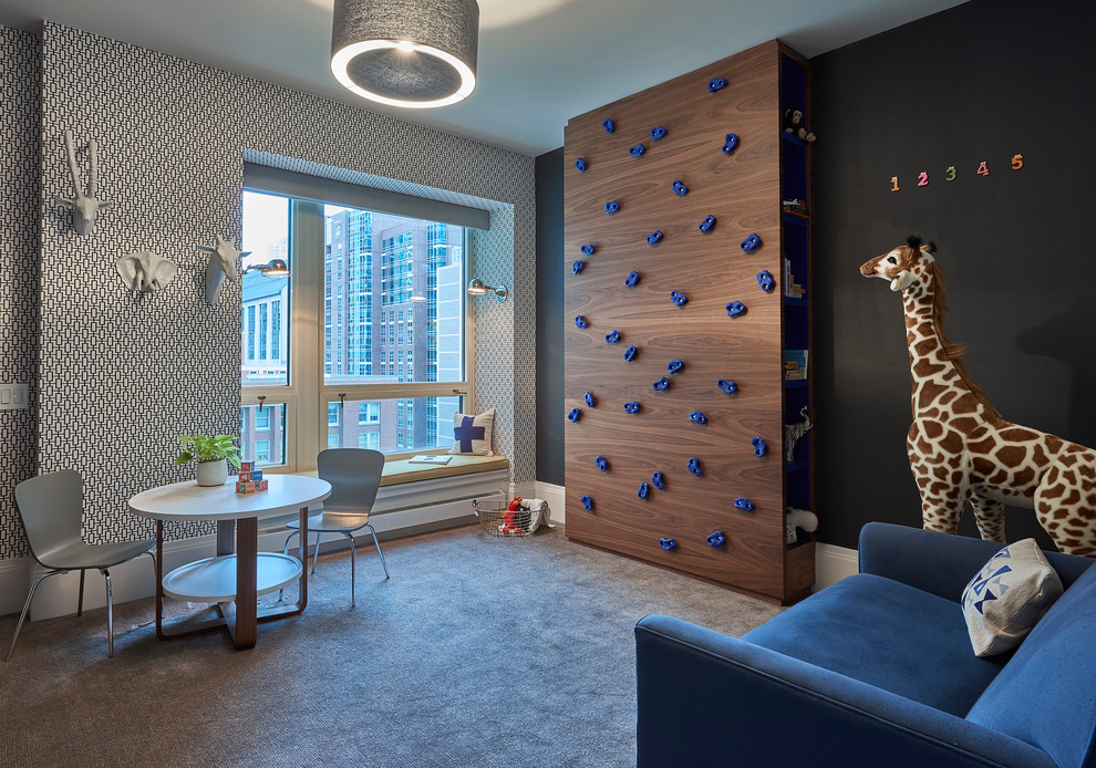 This is an example of a contemporary gender neutral playroom in Chicago with black walls, carpet and grey floors.