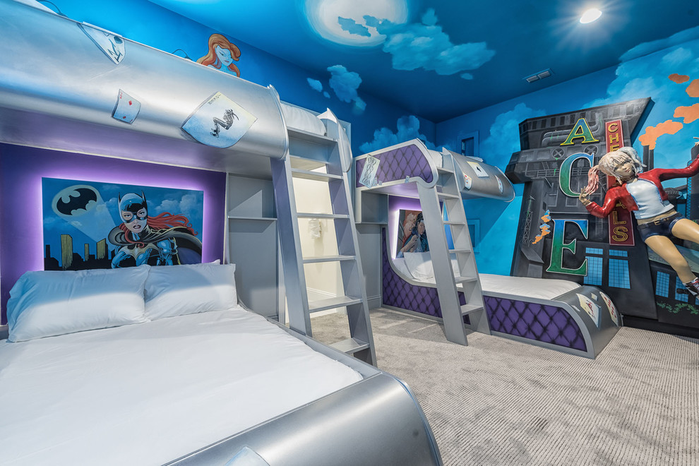 Cette image montre une grande chambre d'enfant bohème avec un mur multicolore et moquette.