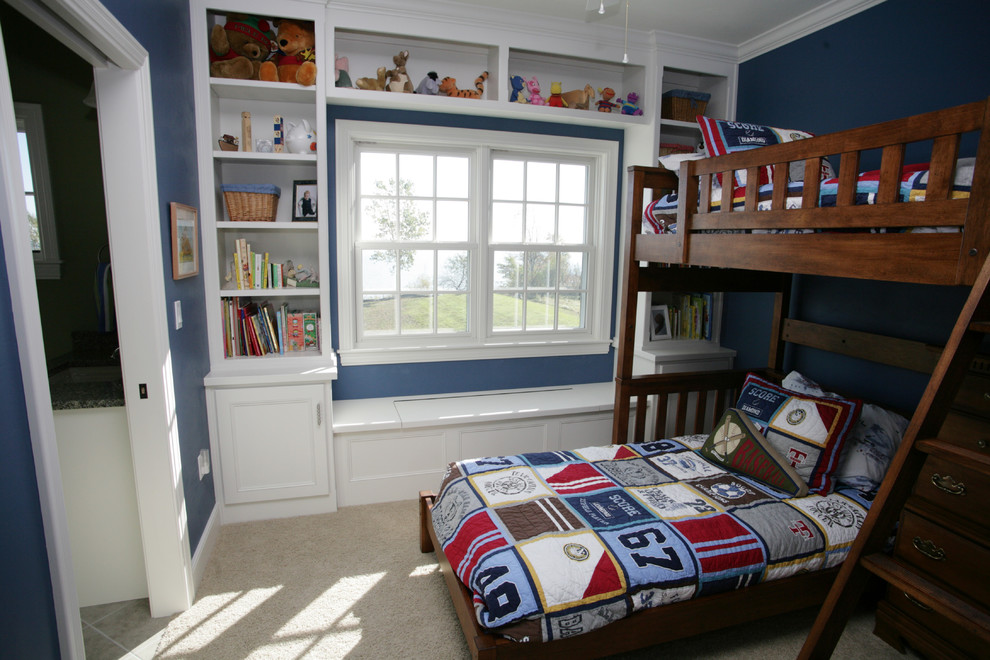 This is an example of a small classic kids' bedroom for boys in Other with blue walls and carpet.