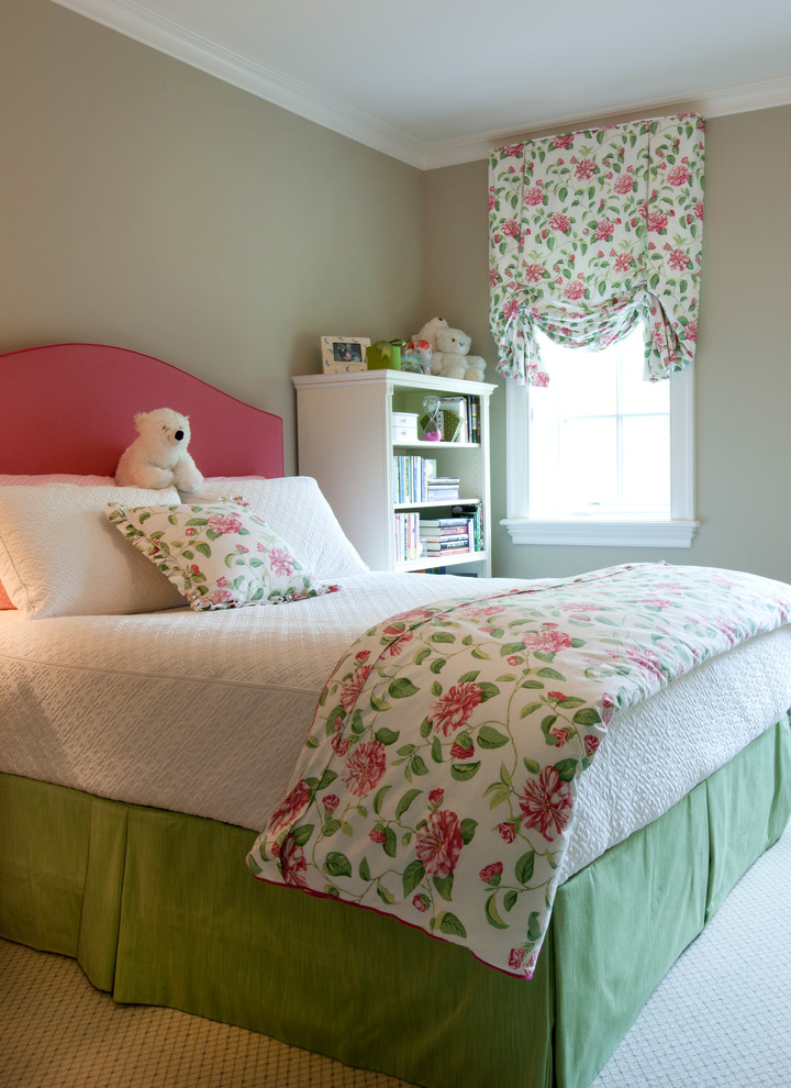 Photo of a medium sized traditional children’s room for girls in Chicago with green walls and carpet.