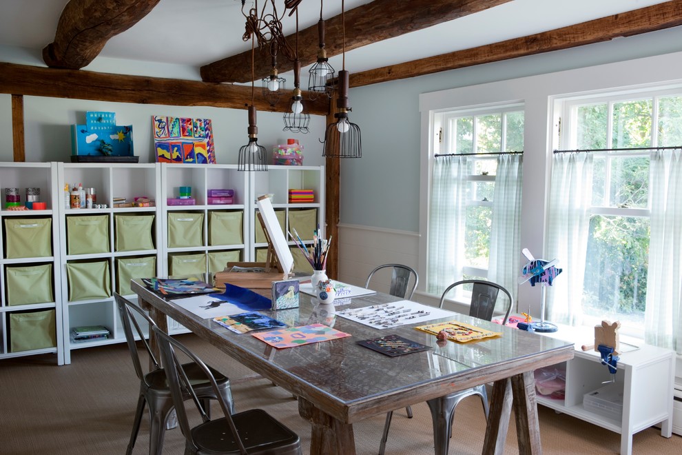 Farmhouse gender neutral kids' study space in New York with blue walls and carpet.