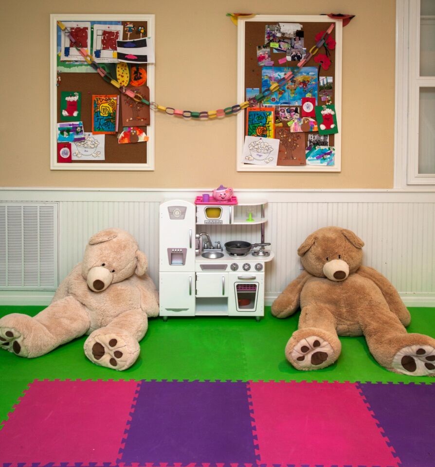 Inspiration for a large contemporary gender-neutral carpeted kids' room remodel in Houston with yellow walls
