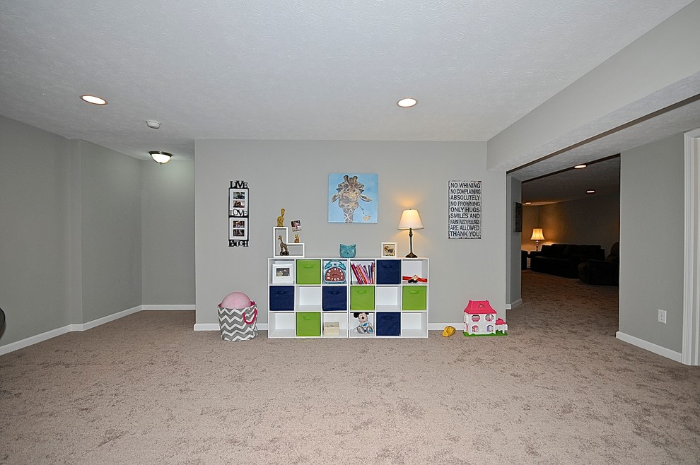 Design ideas for a contemporary gender neutral kids' bedroom in Indianapolis with grey walls and carpet.