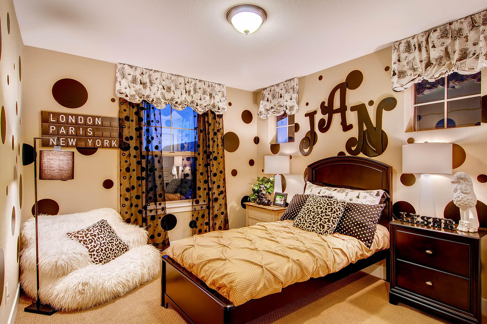 This is an example of a traditional kids' bedroom for girls in Denver with beige floors.