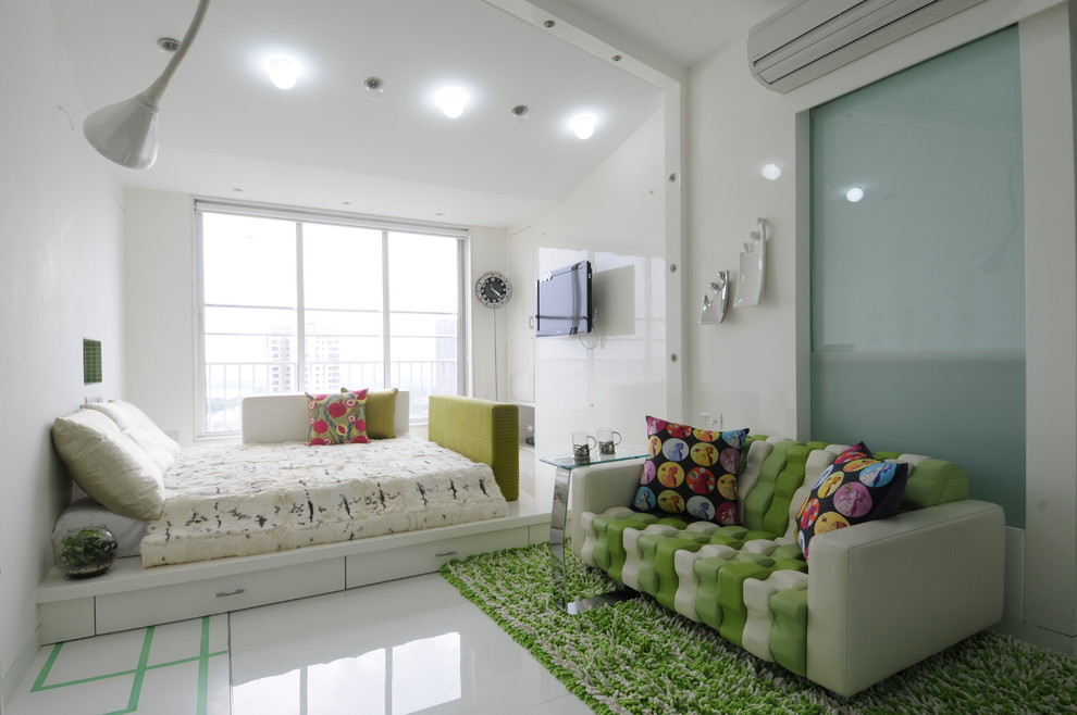 Inspiration for a contemporary girl kids' room remodel in Mumbai with white walls