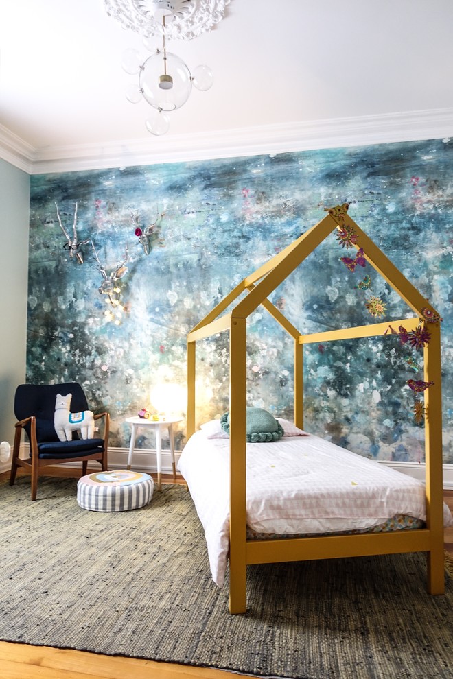 Eclectic kids' bedroom in Sydney with blue walls, medium hardwood flooring, brown floors and feature lighting.