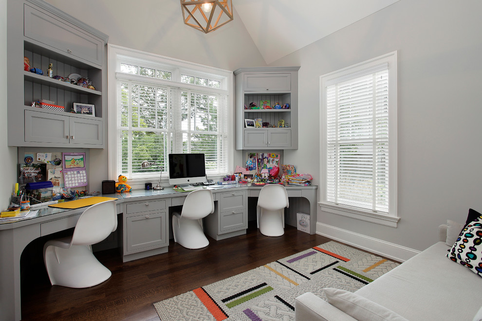 Kids' room - contemporary gender-neutral dark wood floor and brown floor kids' room idea in Chicago with gray walls