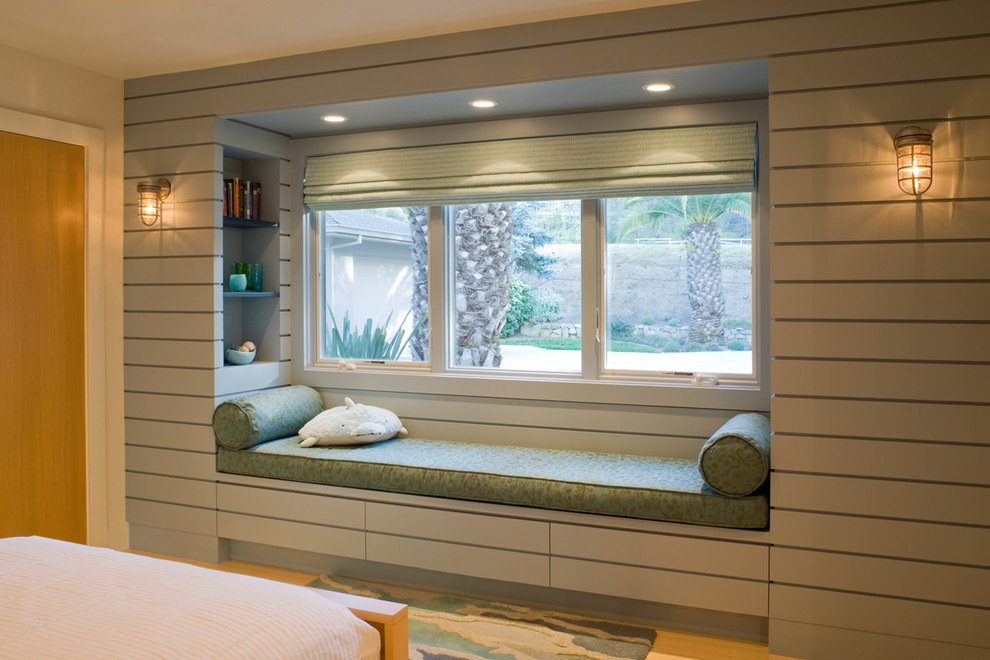 Design ideas for a modern gender neutral kids' bedroom in San Francisco with grey walls and light hardwood flooring.