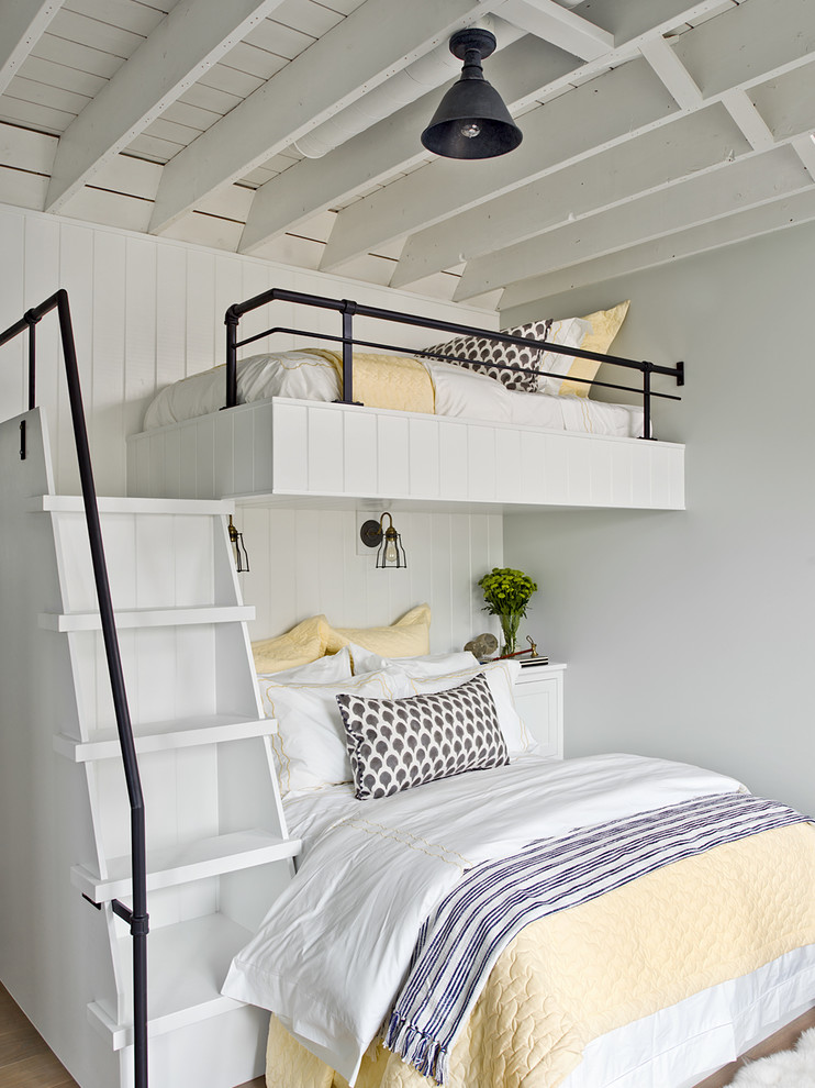 Design ideas for a farmhouse kids' bedroom in Chicago with grey walls, medium hardwood flooring and brown floors.