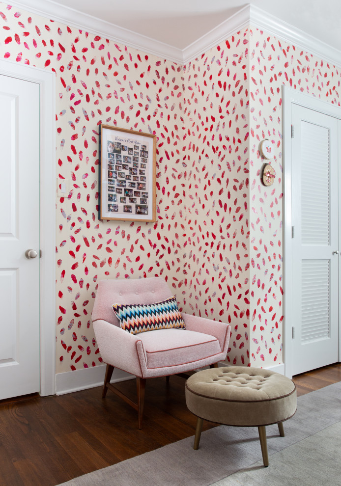 This is an example of a medium sized traditional gender neutral kids' bedroom in Austin with red walls, medium hardwood flooring, brown floors and wallpapered walls.