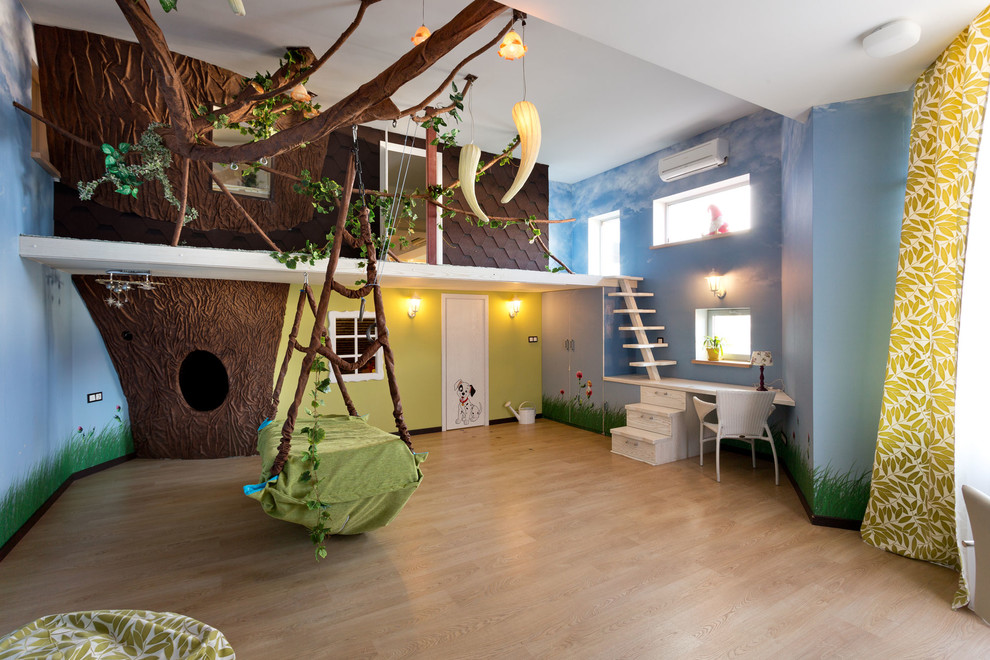 Example of a trendy gender-neutral light wood floor playroom design in Other with blue walls