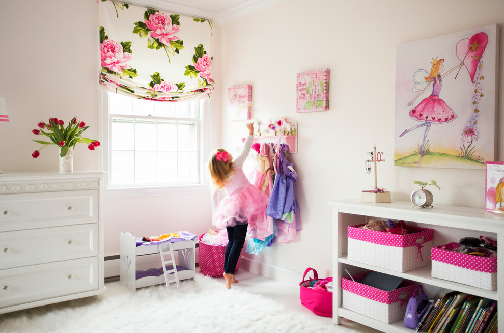Design ideas for a medium sized classic kids' bedroom in Boston with pink walls, carpet and white floors.