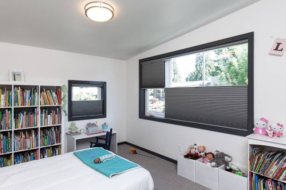 Example of a large minimalist girl carpeted kids' room design in Portland with white walls