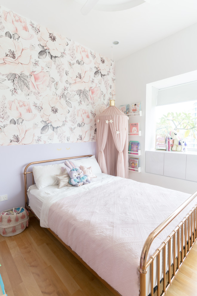 This is an example of a medium sized contemporary children’s room for girls in Wellington with multi-coloured walls and beige floors.