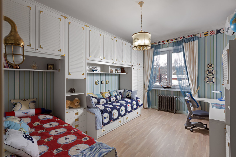Medium sized traditional kids' bedroom for boys in Other with blue walls and light hardwood flooring.