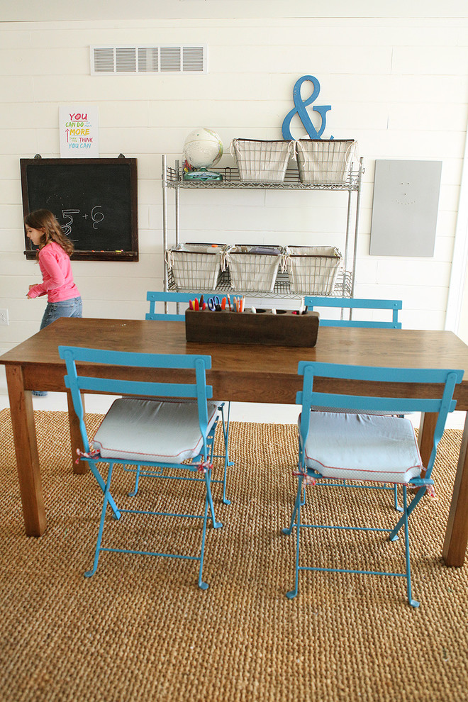 Farmhouse gender-neutral kids' study room photo in Columbus with white walls