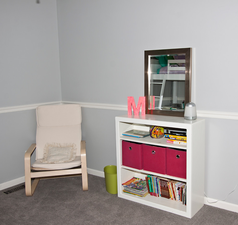 This is an example of a small traditional children’s room for girls in Kansas City with grey walls and carpet.