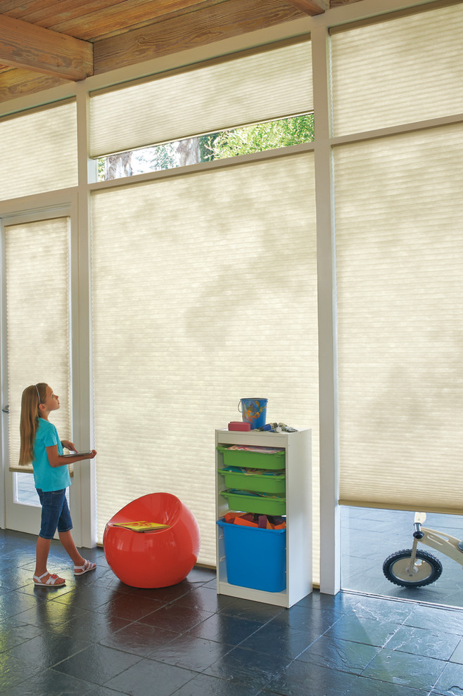 Mid-sized elegant gender-neutral slate floor kids' room photo in Miami