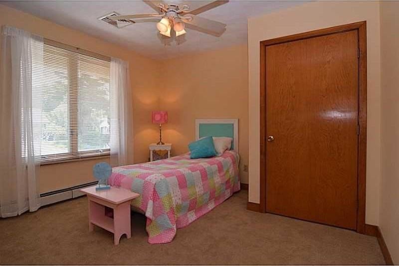 Design ideas for a medium sized classic children’s room for girls in Providence with beige walls, carpet and beige floors.