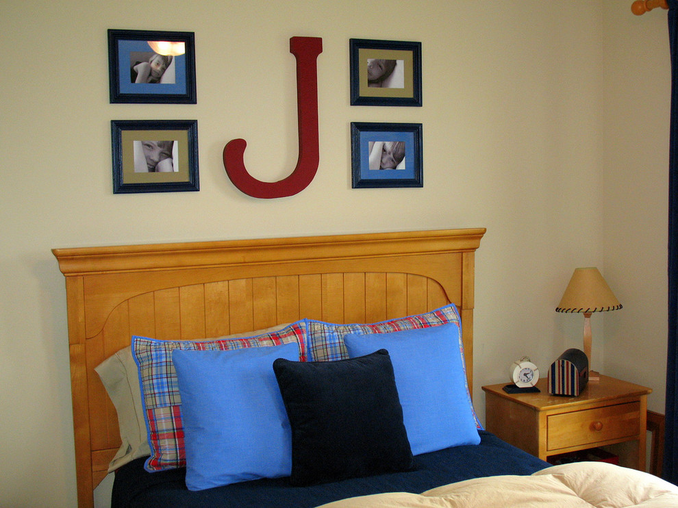Example of a classic boy kids' bedroom design in Other with beige walls