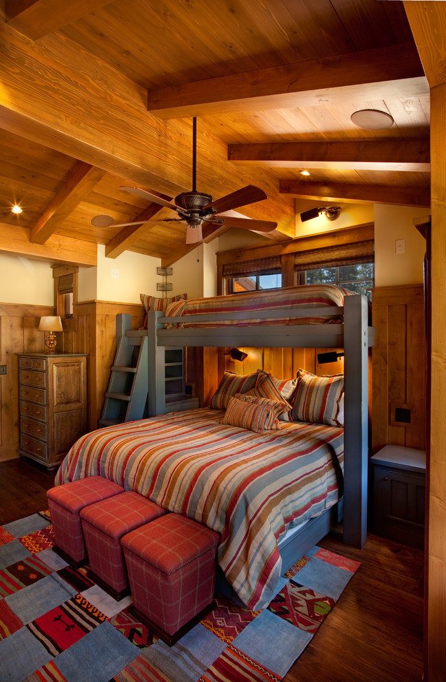Photo of a medium sized rustic children’s room for boys in Sacramento with beige walls and dark hardwood flooring.