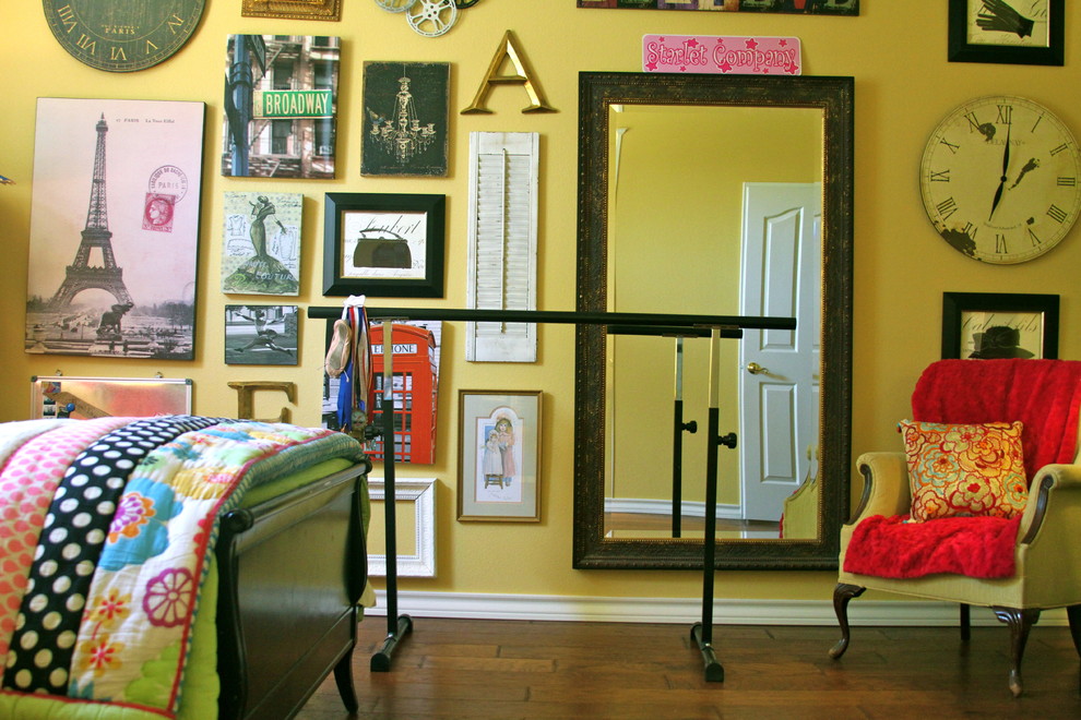 This is an example of a bohemian kids' bedroom in Austin with yellow walls.