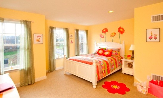 Design ideas for a medium sized classic children’s room for girls in Other with yellow walls and carpet.