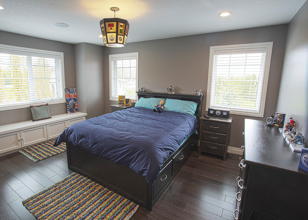 Photo of a medium sized traditional teen’s room for boys in Other with grey walls, dark hardwood flooring and brown floors.