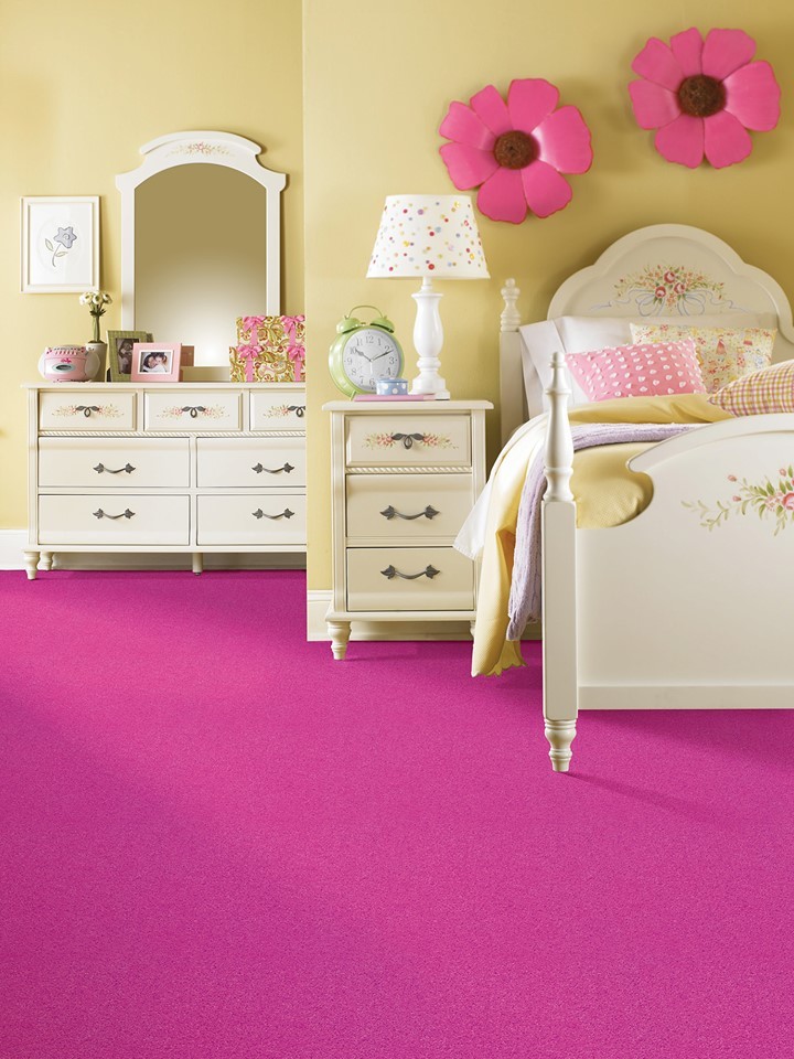 Photo of a medium sized contemporary children’s room for girls in Grand Rapids with beige walls and carpet.