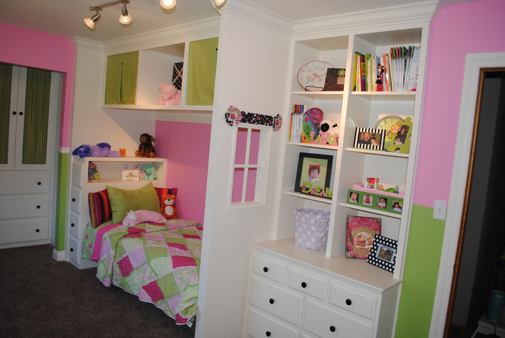 Mid-sized elegant girl carpeted and gray floor kids' room photo in Denver with pink walls