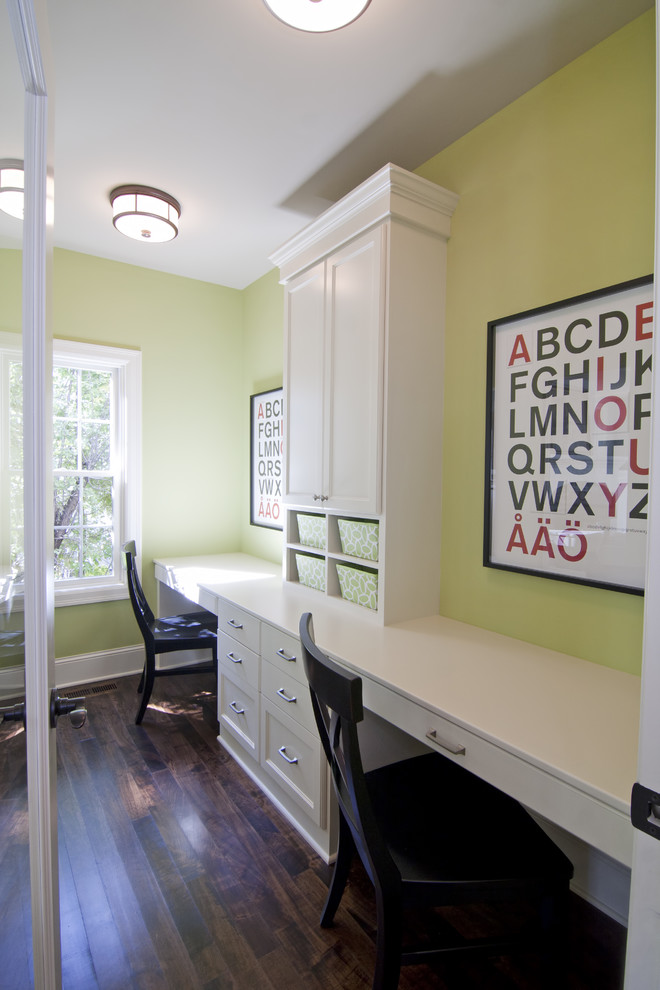 Elegant kids' room photo in Minneapolis with green walls