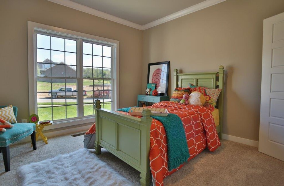 Medium sized traditional teen’s room for girls in Louisville with beige walls and carpet.