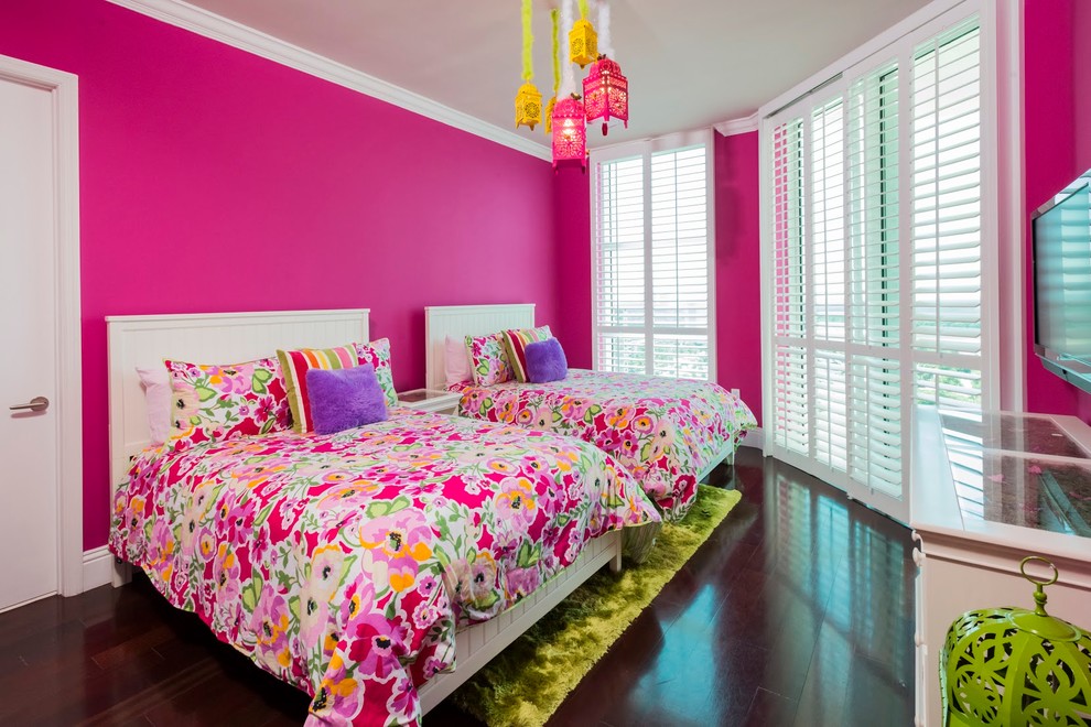 Inspiration for a transitional girl dark wood floor kids' room remodel in Miami with pink walls