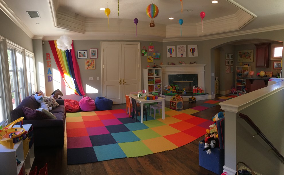 This is an example of a large contemporary kids' bedroom in Los Angeles with grey walls and dark hardwood flooring.