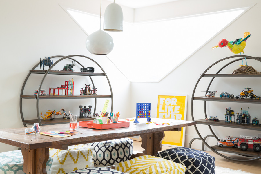Eclectic gender-neutral light wood floor kids' room photo in San Francisco with white walls