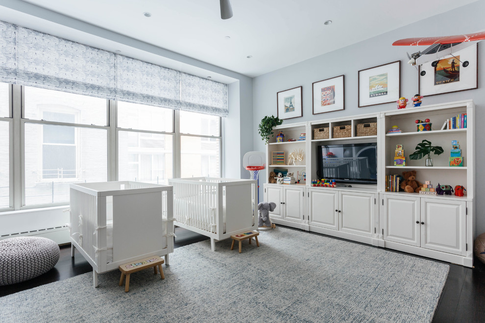 Expansive classic gender neutral toddler’s room in New York with painted wood flooring, black floors and grey walls.