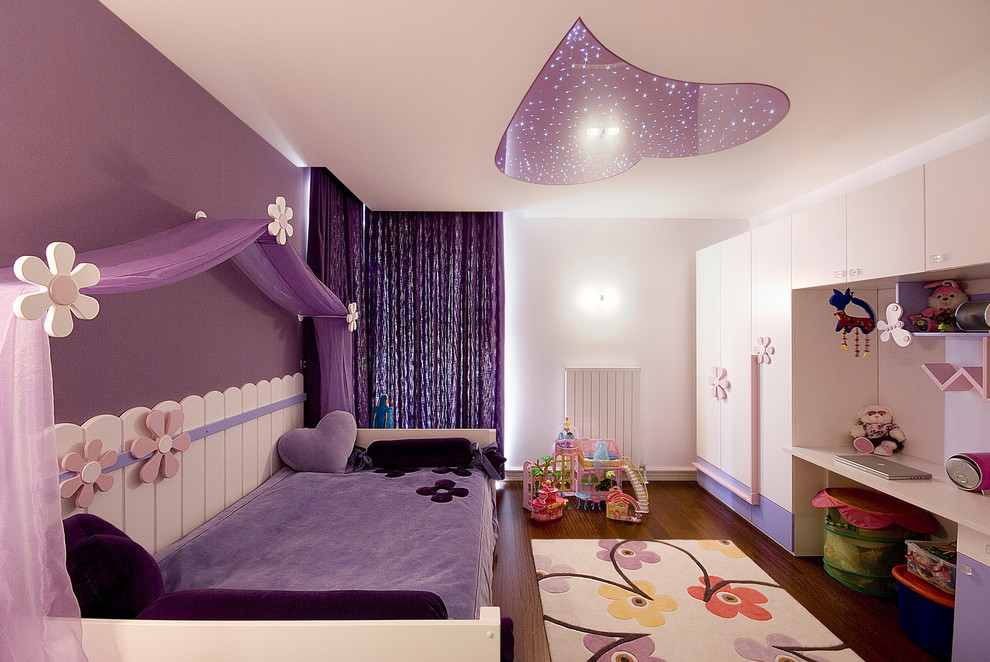 Trendy kids' room photo in Other with multicolored walls
