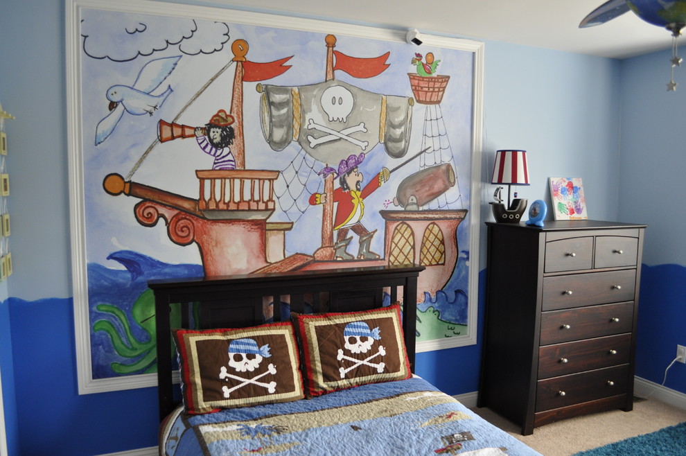 Esempio di una cameretta per bambini da 1 a 3 anni boho chic con pareti blu