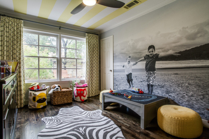 Small eclectic gender neutral kids' bedroom in Dallas with grey walls and dark hardwood flooring.