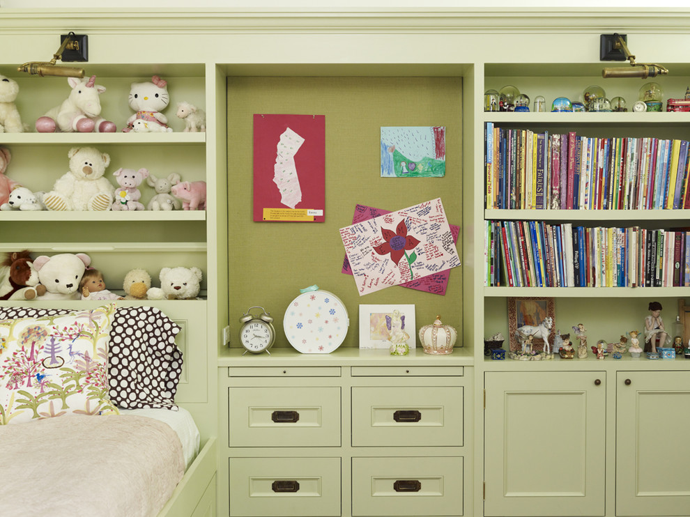Photo of a traditional kids' bedroom for girls in Los Angeles with green walls.