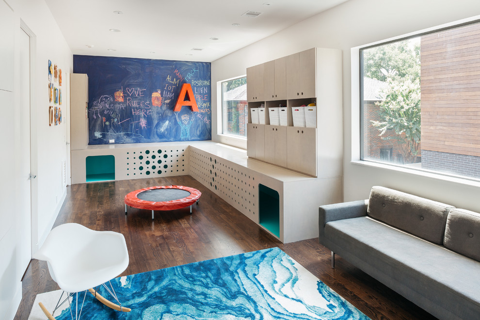 Inspiration for a contemporary gender-neutral dark wood floor playroom remodel in Houston with white walls