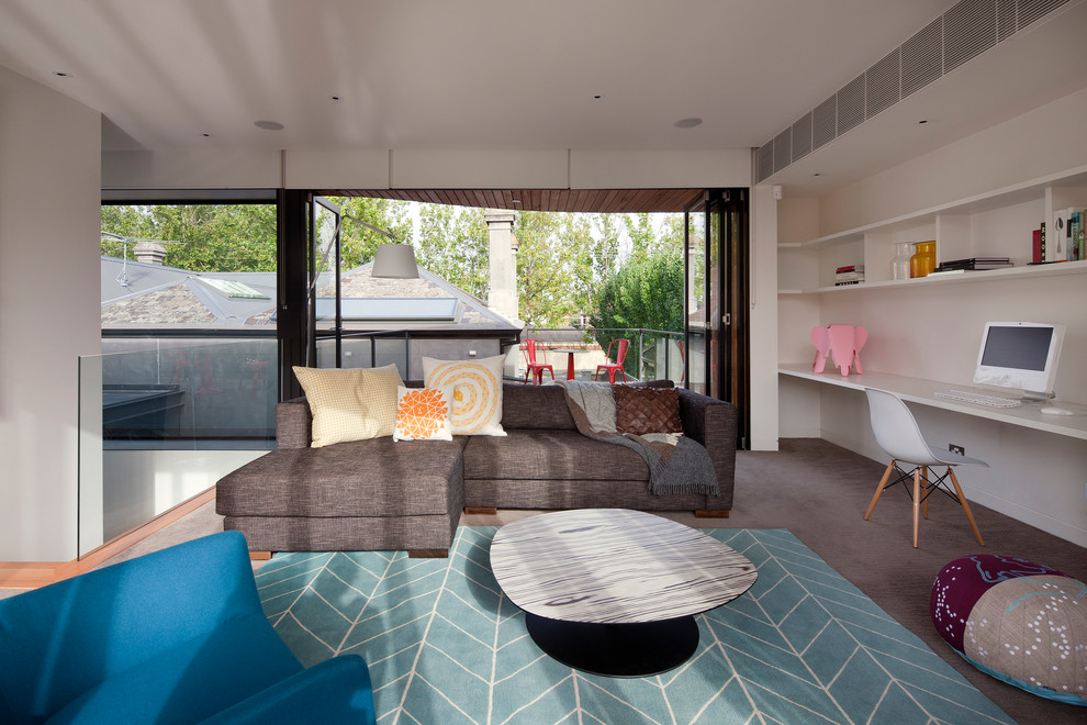 Example of a trendy carpeted playroom design in Melbourne with white walls