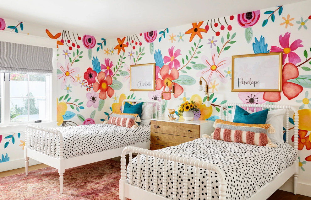 Photo of a traditional kids' bedroom for girls in Phoenix with multi-coloured walls, medium hardwood flooring, brown floors and wallpapered walls.