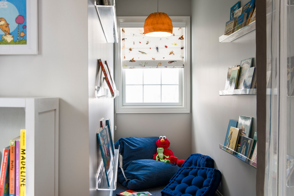 This is an example of a small traditional gender neutral kids' bedroom in Chicago with grey walls.