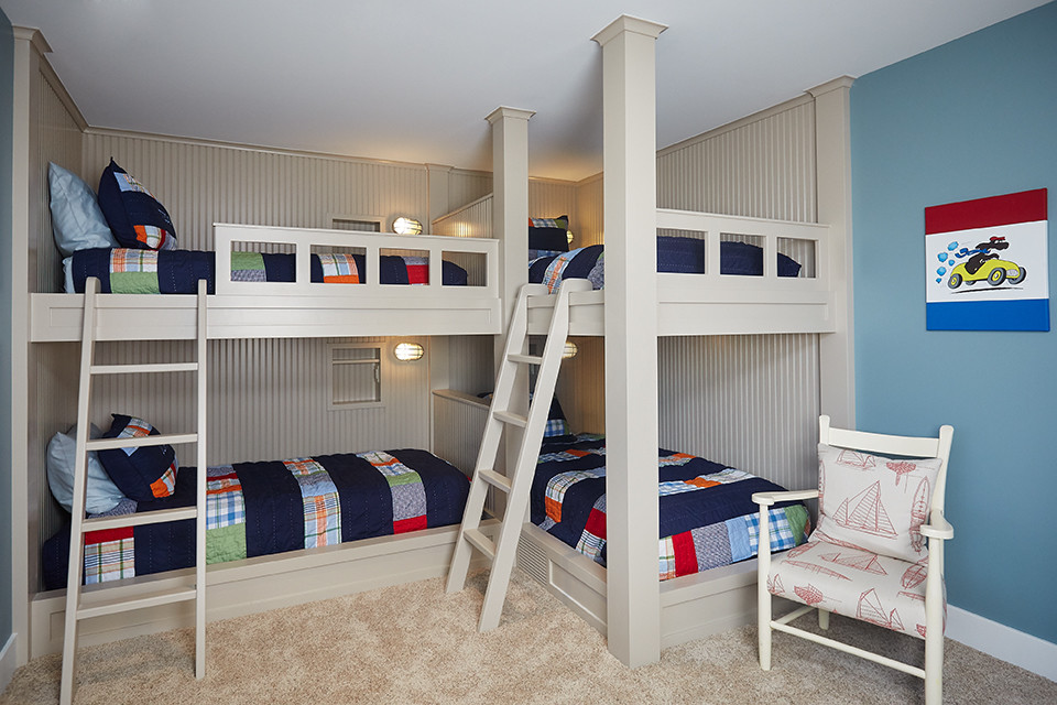 Example of a mid-sized beach style boy carpeted and brown floor kids' room design in Grand Rapids with blue walls