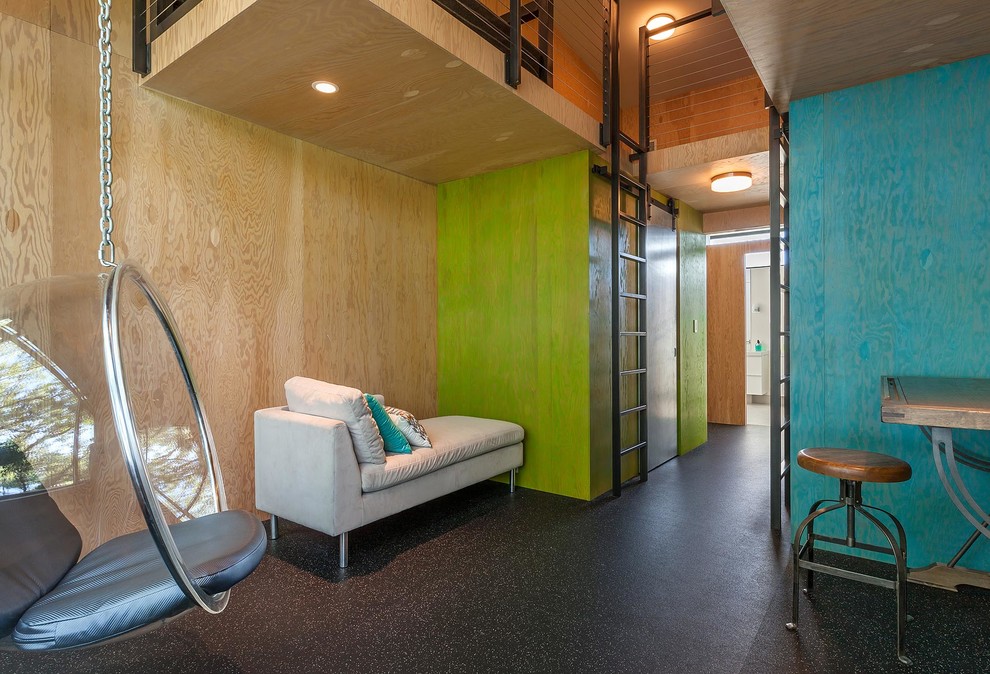 Foto på ett funkis barnrum kombinerat med sovrum, med gröna väggar och svart golv