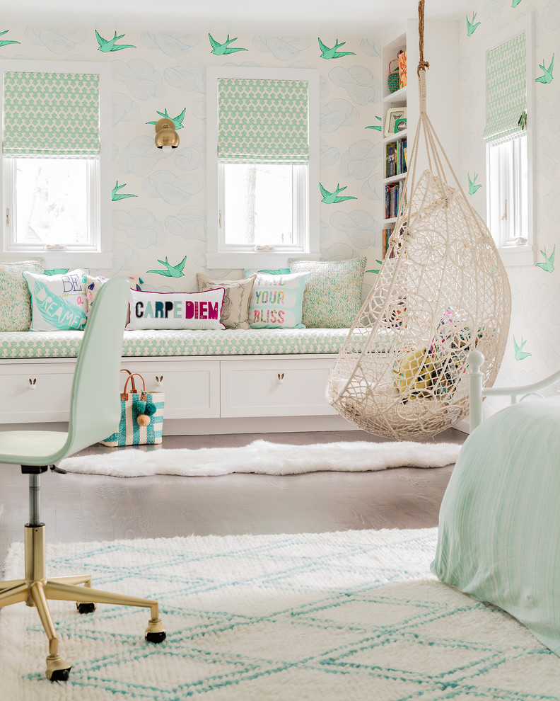 Large transitional girl light wood floor and brown floor kids' room photo in New York with multicolored walls